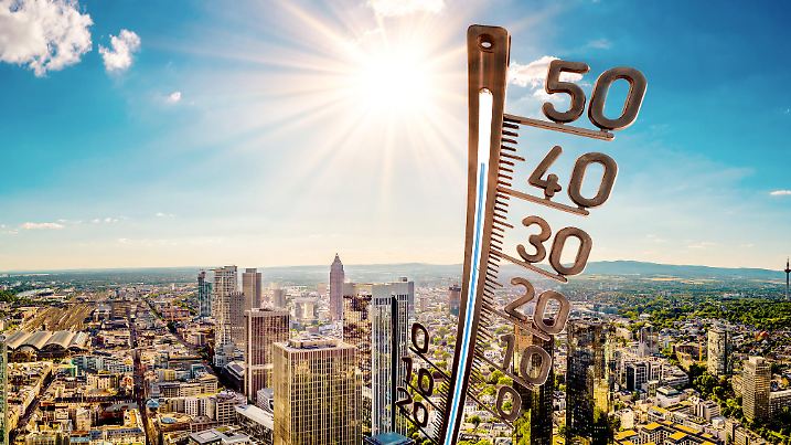 Panorama of Frankfurt am Main on a hot summer day with bright sun and big thermometer