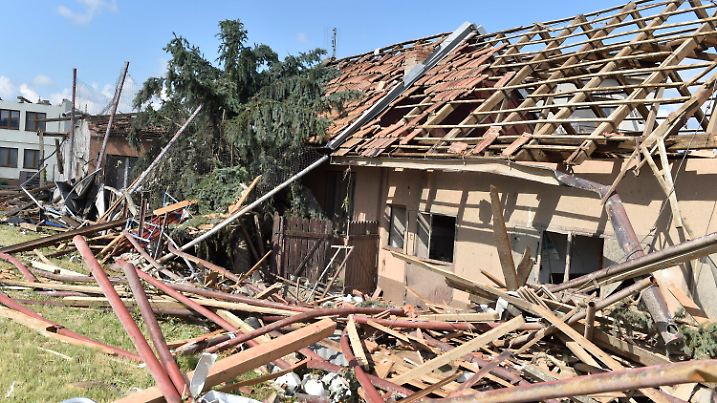 Damaged houses are seen after a tornado hit the village of Moravska Nova Ves in the Breclav district, South Moravia, Czech Republic, on Friday, June 25, 2021. A rare tornado tore through southeastern Czech Republic, killing a few people and injuring hundreds, rescue services said on Friday. (Vaclav Salek/CTK via AP)