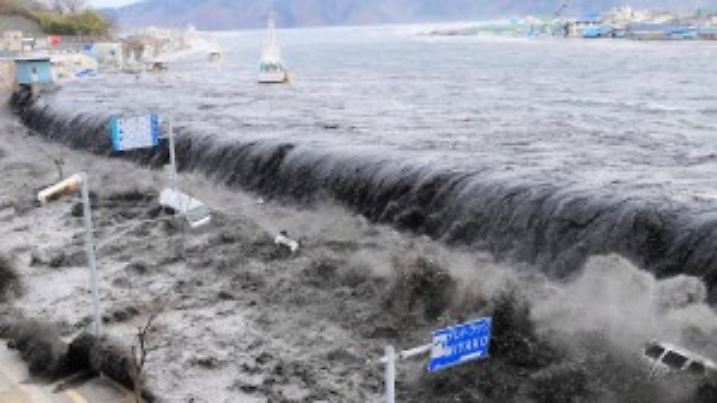 FILE - A picture released 15 March 2011 shows waves overwhelm a levee, swallowing a seaside village near the mouth of Hei River, Japan, 11 March 2011 after a tsunami and an earthquake hit Japan 11 March 2011. A Japanese paper reporst Friday, March 18 2011, that the tsunami wave, which hit the country March 11, was up to 23 meters high.  EPA/Mainichi Newspaper JAPAN OUT EDITORIAL USE ONLY/NO SALES EPA/AFLO/Mainichi Newspaper JAPAN OUT EDITORIAL USE ONLY/NO SALES EDITORIAL USE ONLY/NO SALES  +++(c) dpa - Bildfunk+++