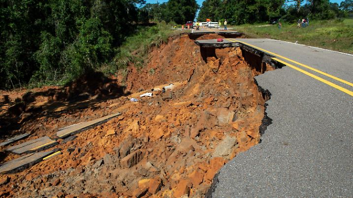 Part of Highway 26 washed away late Monday night, due to heavy rains from Hurricane Ida in the Benndale community in George County, Tuesday, Aug. 31, 2021. (Hannah Ruhoff/The Sun Herald via AP)
