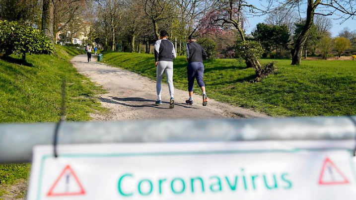 March 26, 2020, Brussels, Belgium: Brussels , 26/03/2020.Illustration of the Corona Virus - COVID-19 epidemic and the effects of it on the day tot day life ..Pix : Coronavirus sign in the Forest park in Brussels with mans running.Credit : Daina Le Lardic / Brussels Belgium - ZUMAi29 20200326ziai29072 Copyright: xIsopixx