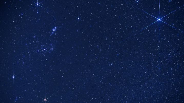 Thousands of stars shine in the sky on a dark night, with Sirius (upper right corner) and Orion constellation (to the left). Sirius is the brightest star in Earth's night sky, the name means "glowing" in Greek. Picture taken in March, Atacama Desert, Chile. Orion is one of the most recognizable constellations in the night sky named after a hunter in Greek mythology. Its brightest stars are Betelgeuse (Alpha Orionis, red supergiant in the lower left corner, and Rigel (Beta Orionis, blue-white supergiant in the upper left corner). Three stars in a row (Mintaka, Alnilam and Alnitak) form Orion’s Belt while another three slightly up are Hunter’s Sword with hazy Messier M42 Orion Nebula.