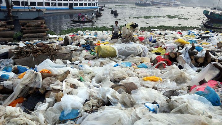 February 11, 2022, Dhaka, Bangladesh: A man is seen checking plastic waste, polyethylene terephthalate (PET), that is used in making plastic goods after recycling near the Buriganga River. (Credit Image: © Habibur Rahman/ZUMA Press Wire Service