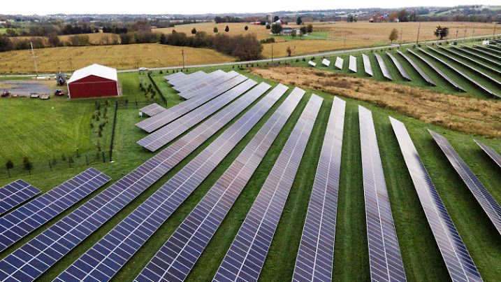 FILE - Farmland is seen with solar panels from Cypress Creek Renewables, Oct. 28, 2021, in Thurmont, Md. The Commerce Department says it is investigating whether imports of solar panels from Southeast Asia are circumventing anti-dumping rules that block imports from China. The decision could dramatically reduce solar imports to the U.S. and undercut President Joe Biden’s ambitious climate goals. Clean energy leaders said the investigation could lead to thousands of layoffs in the domestic solar industry and imperil up to 80% of planned solar projects in the U.S. (AP Photo/Julio Cortez, File)