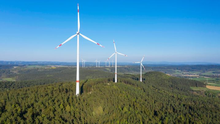 Drone view of forest wind farm in spring RUEF03351