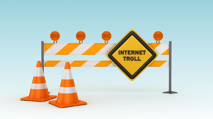 INTERNET TROLL Road Sign with Barrier and Cones - Blue Background - 3D Rendering