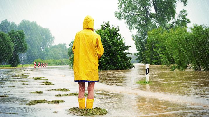 Woman standing in a flooded street