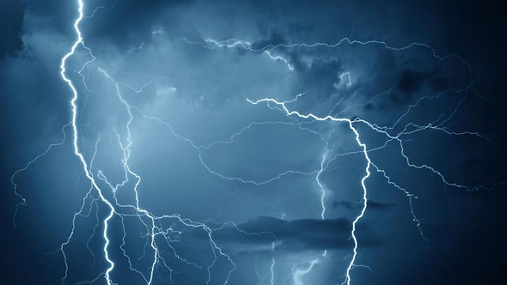 Lightning during storm on dark summer night.