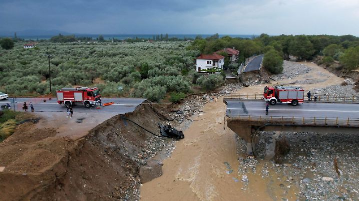 Firefighting crews are seen on a collapsed bridge, as storm Daniel hits central Greece, in the village of Kala Nera, Greece, September 7, 2023. REUTERS/Stamos Prousalis     TPX IMAGES OF THE DAY