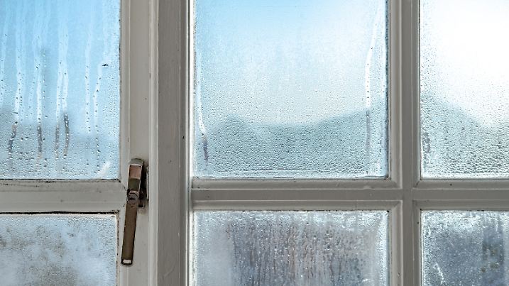 Showing the wooden frame and metal lock, the condensation is known to cause damp and mould.