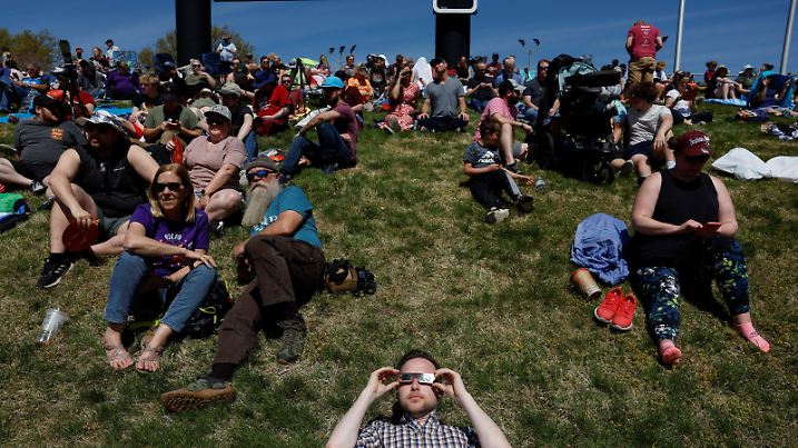 People gather at Saluki Stadium, ahead of a total solar eclipse, where the moon will blot out the sun, in Carbondale, Illinois, U.S. April 8, 2024. REUTERS/Evelyn Hockstein