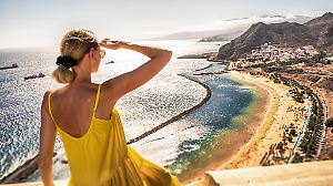 Amazing place to visit. Woman looking at the landscape of Las Teresitas beach and San Andres village, Tenerife, Canary Islands, Spain. Tourism. Vacation. Travel.