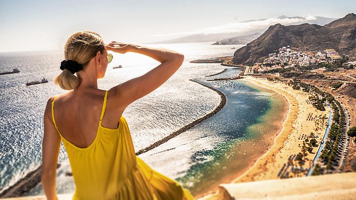 Amazing place to visit. Woman looking at the landscape of Las Teresitas beach and San Andres village, Tenerife, Canary Islands, Spain. Tourism. Vacation. Travel.