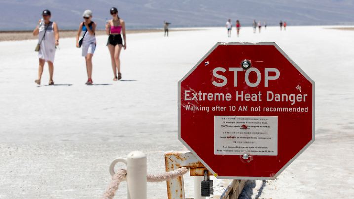 A stop sign warns tourists of extreme heat at Badwater Basin, Monday, July 8, 2024, in Death Valley National Park, Calif. (Daniel Jacobi II/Las Vegas Review-Journal via AP)