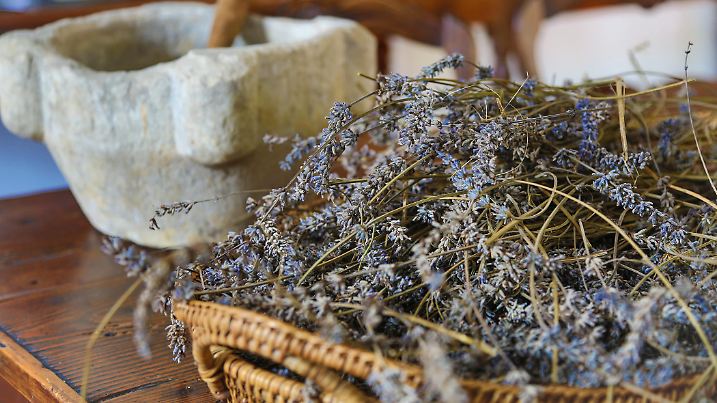 Lavender piled in a straw basket classic french kitchen