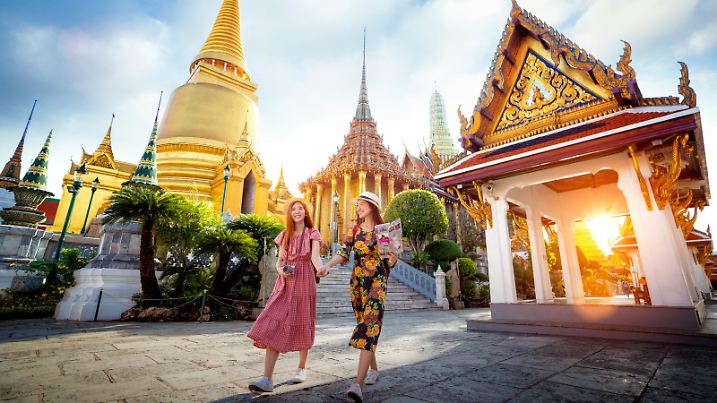 Asian girl walk in Wat phra kaew and grand palace travel in Bangkok city, Thailand