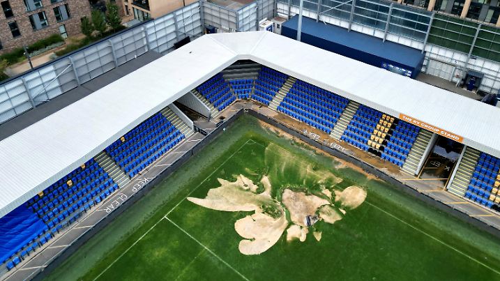FILE PHOTO: A drone view of a sink hole caused by heavy rainfall at the Cherry Red Records Stadium, home of AFC Wimbledon football club in London, Britain, September 23, 2024. REUTERS/Hannah McKay/File Photo