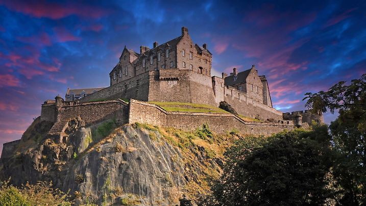 Edinburgh, Scotland - September 20, 2016: Edinburgh Castle with dramatic evening sky colors