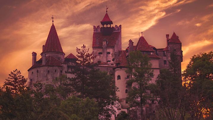Bran, Romania - June 6, 2016: Sunset at the 14th century Bran castle, famous for the dracula legend. The castle is now a museum and open for tourists.
