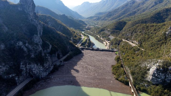 Aerial view of waste stuck at the dam on the Neretva river caused by landslides, torrential rain and flash floods in Grabovica, Bosnia, Sunday, Oct. 13, 2024. (AP Photo/Armin Durgut)