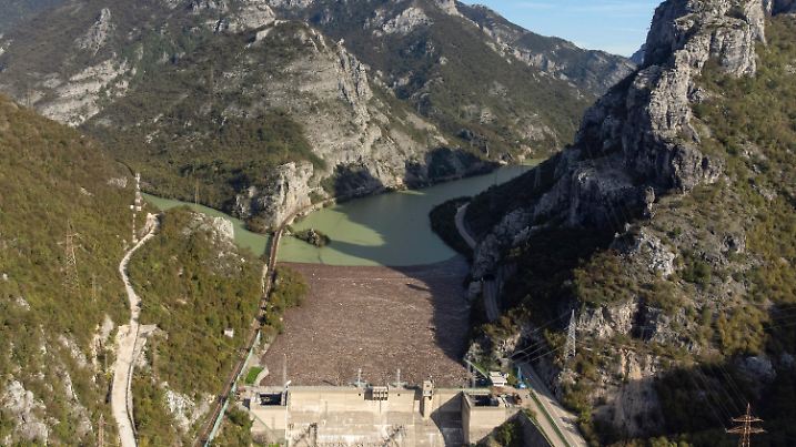Aerial view of waste stuck at the dam on the Neretva river caused by landslides, torrential rain and flash floods in Grabovica, Bosnia, Sunday, Oct. 13, 2024. (AP Photo/Armin Durgut)
