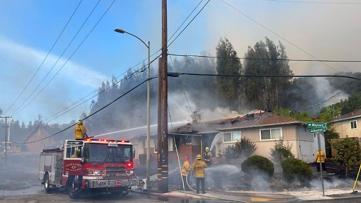 Firefighters work to stop a fire that damaged multiple structures, in Oakland, California, U.S., October 18, 2024. Oakland Fire Department (CA)/Handout via REUTERS THIS IMAGE HAS BEEN SUPPLIED BY A THIRD PARTY. MANDATORY CREDIT. NO RESALES. NO ARCHIVES