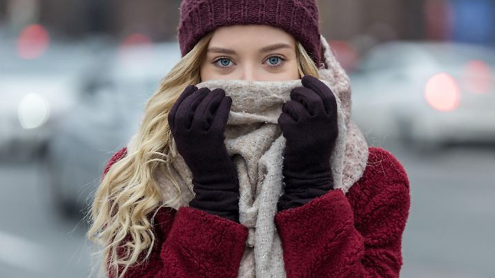 Young woman feeling cold in winter