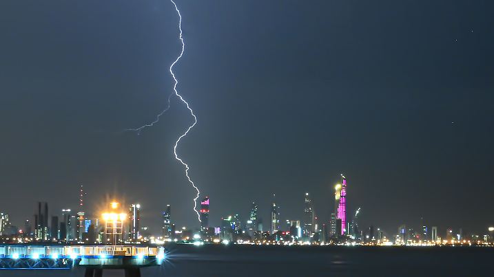 (241031) -- KUWAIT CITY, Oct. 31, 2024 (Xinhua) -- This photo taken on Oct. 30, 2024 shows a bolt of lightning over the skyline of Kuwait City, Kuwait. (Photo by Asad/Xinhua)