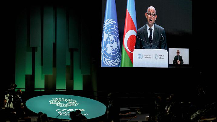 November 12, 2024, Baku, Azerbaijan, Azerbaijan: SIMON STIELL, Executive Secretary of UNFCCC is projected on a Jumbotron as he speaks at the opening of The World Leaders Climate Action Summit with a illuminated floor of COP29 logo and colors inside the Plenary room Nizami inside the Baku Olympic Stadium..The COP is the largest gathering of High Level officials in the world that focuses on climate change. This year is labeled as Finance COP in which financial resolutions are at the top of the list of a lengthy agenda of listed concerns. (Credit Image: © Bianca Otero/ZUMA Press Wire) / action press