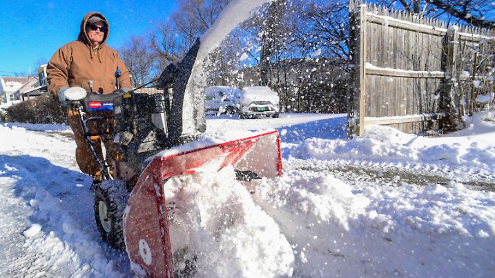 Richard Frost uses a snowblower to remove some of the snow off his driveway on Monday, Jan. 20, 2025, in Brattleboro, Vt., after a snowstorm had dropped several inches. (Kristopher Radder/The Brattleboro Reformer via AP)