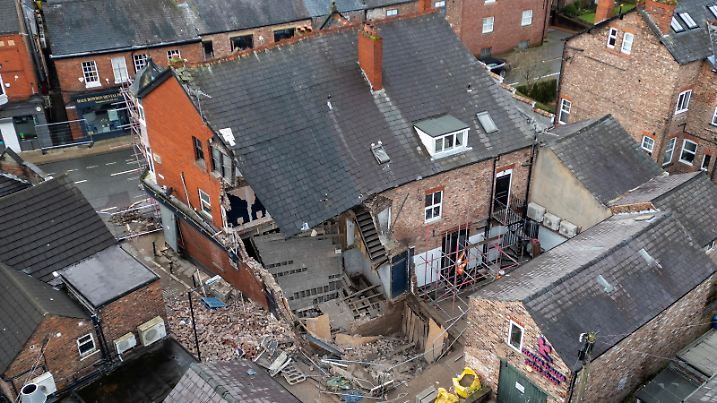 A drone view shows damage to a partially collapsed building that was undergoing repairs before being damaged by high winds during Storm Eowyn in Hale, Britain, January 26, 2025. REUTERS/Phil Noble