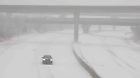 A vehicle travels westbound in blizzard conditions during a winter storm on Interstate 70 in Topeka, Kansas, U.S. January 5, 2025. Evert Nelson/The Capital-Journal/USA Today Network via REUTERS    NO RESALES. NO ARCHIVES. MANDATORY CREDIT