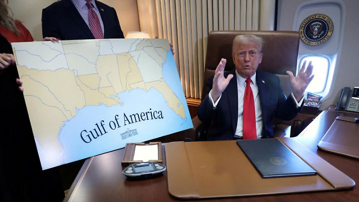 U.S. President Donald Trump speaks to reporters after signing a proclamation renaming the Gulf of Mexico to the Gulf of America, while flying over the gulf aboard Air Force One en route to New Orleans to attend the Super Bowl, February 9, 2025. REUTERS/Kevin Lamarque TPX IMAGES OF THE DAY