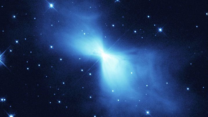 The Boomerang Nebula is a young planetary nebula and the coldest object found in the Universe so far. The NASA/ESA Hubble Space Telescope image is yet another example of how Hubble's sharp eye reveals surprising details in celestial objects. This NASA/ESA Hubble Space Telescope image shows a young planetary nebula known (rather curiously) as the Boomerang Nebula. It is in the constellation of Centaurus, 5000 light-years from Earth. Planetary nebulae form around a bright, central star when it expels gas in the last stages of its life. The Boomerang Nebula is one of the Universe's peculiar places. In 1995, using the 15-metre Swedish ESO Submillimetre Telescope in Chile, astronomers  Sahai and Nyman revealed that it is the coldest place in the Universe found so far. With a temperature of -272C, it is only 1 degree warmer than absolute zero (the lowest limit for all temperatures). Even the -270C background glow from the Big Bang is warmer than this nebula. It is the only object found so far that has a temperature lower than the background radiation. Keith Taylor and Mike Scarrott called it the Boomerang Nebula in 1980 after observing it with a large ground-based telescope in Australia. Unable to see the detail that only Hubble can reveal, the astronomers saw merely a slight asymmetry in the nebula's lobes suggesting a curved shape like a boomerang. The high-resolution Hubble images indicate that 'the Bow tie Nebula' would perhaps have been a better name. The Hubble telescope took this image in 1998. It shows faint arcs and ghostly filaments embedded within the diffuse gas of the nebula's smooth 'bow tie' lobes. The diffuse bow-tie shape of this nebula makes it quite different from other observed planetary nebulae, which normally have lobes that look more like 'bubbles' blown in the gas. However, the Boomerang Nebula is so young that it may not have had time to develop these structures. Why planetary nebulae have so many different shapes is still a mystery. The general b