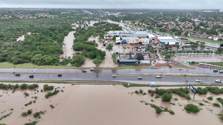 A drone view shows the flooded area at Molapo Crossing Mall and the Western Bypass highway in Gaborone, Botswana, February 19, 2025 in this screengrab from a video obtained from social media. BASHI KIKIA/via REUTERS  THIS IMAGE HAS BEEN SUPPLIED BY A THIRD PARTY. MANDATORY CREDIT. NO RESALES. NO ARCHIVES.