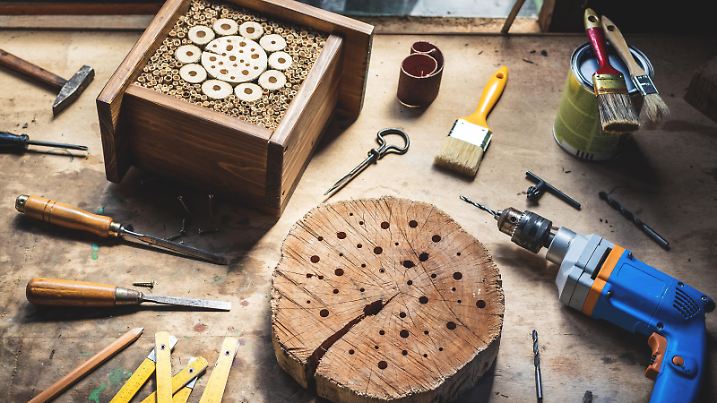 DIY and work tools on table. Drill, chisel, paintbrush, hammer and decorative craft product