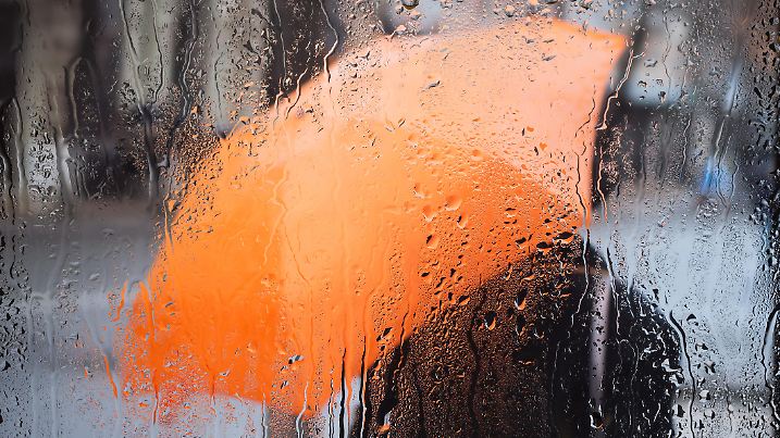 Rainy weather and raindrops on the glass. A window with raindrops.