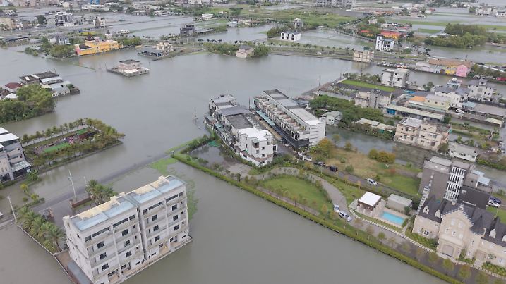 A drone view shows flooded streets and fields in Yilan