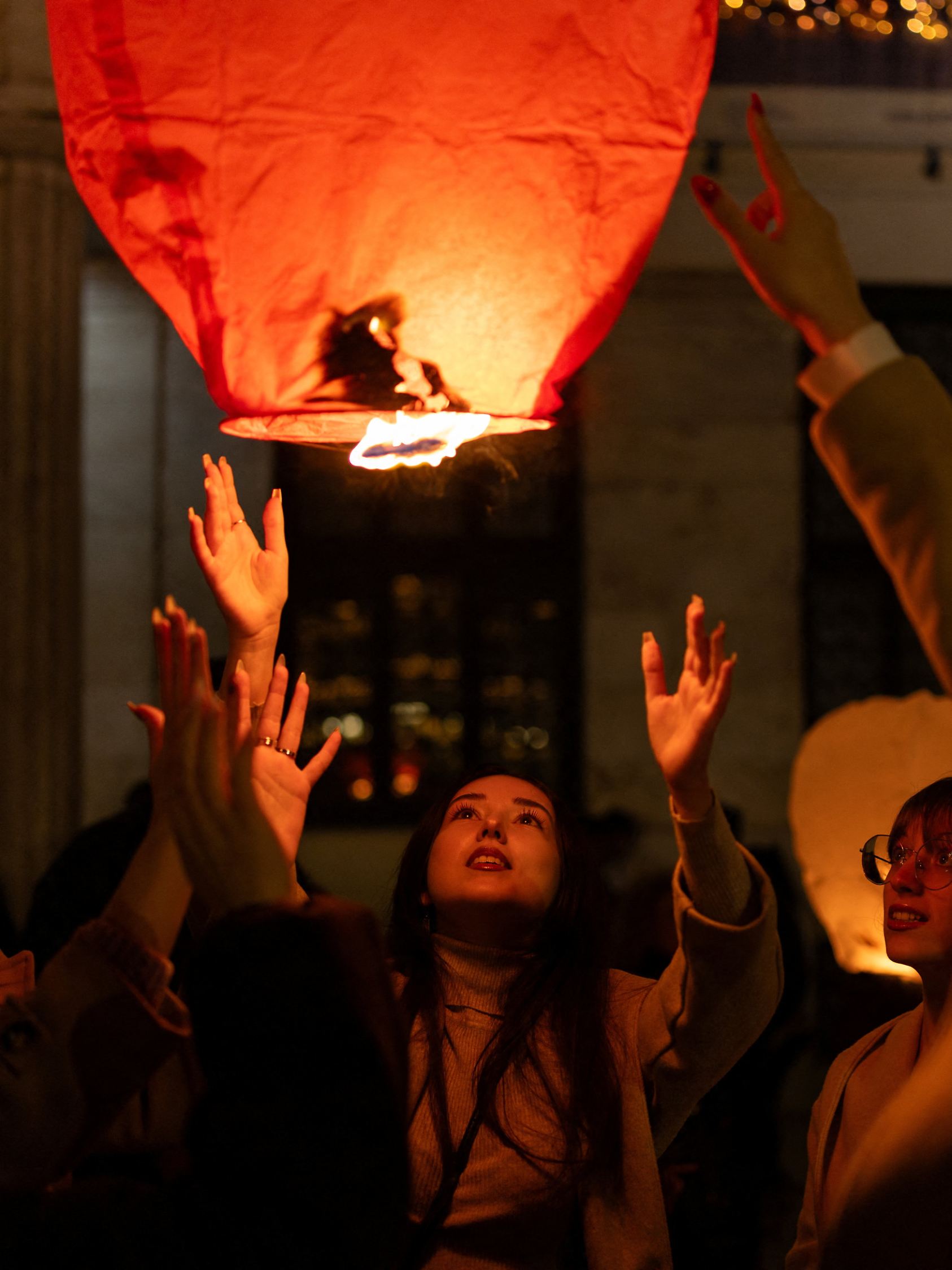 People release sky lanterns during Christmas festivities in Athens