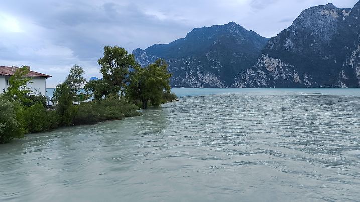 Nago-Torbole, Lake Garda, Italy - June 23, 2024: Volumes of water flow from the Sarca River into Lake Garda in the north