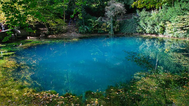 Blautopf (Blue pot) turns blue when sunlight hits it due to the limestone particles in the water.