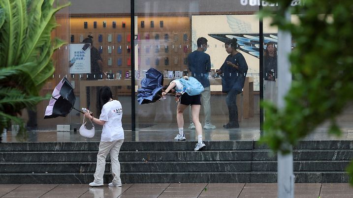 Heavy rain and high winds in Shanghai after Tropical Storm Co-May made landfall in a nearby city