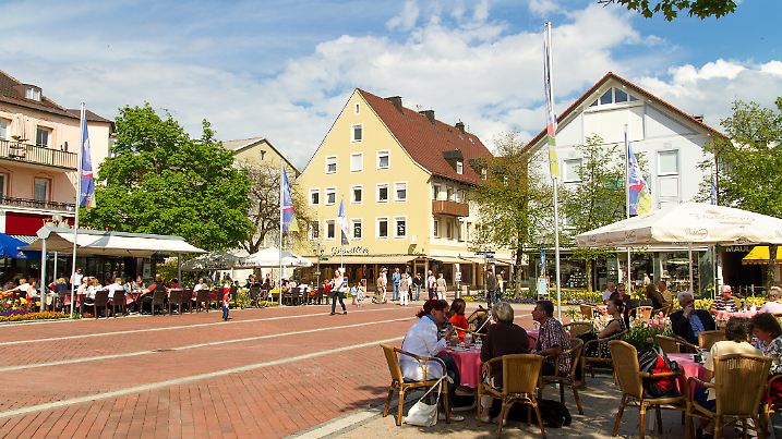 Bad Woerishofen, Germany - May 9, 2013: Bad Woerishofen, Unterallgaeu district, Allgaeu region, Swabia. Tourists enjoy a sunny day in the restaurants of the pedestrian zone.