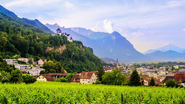 Vaduz town, panoramic view of the capital of Liechtenstein with Alps mountains in background, Europe