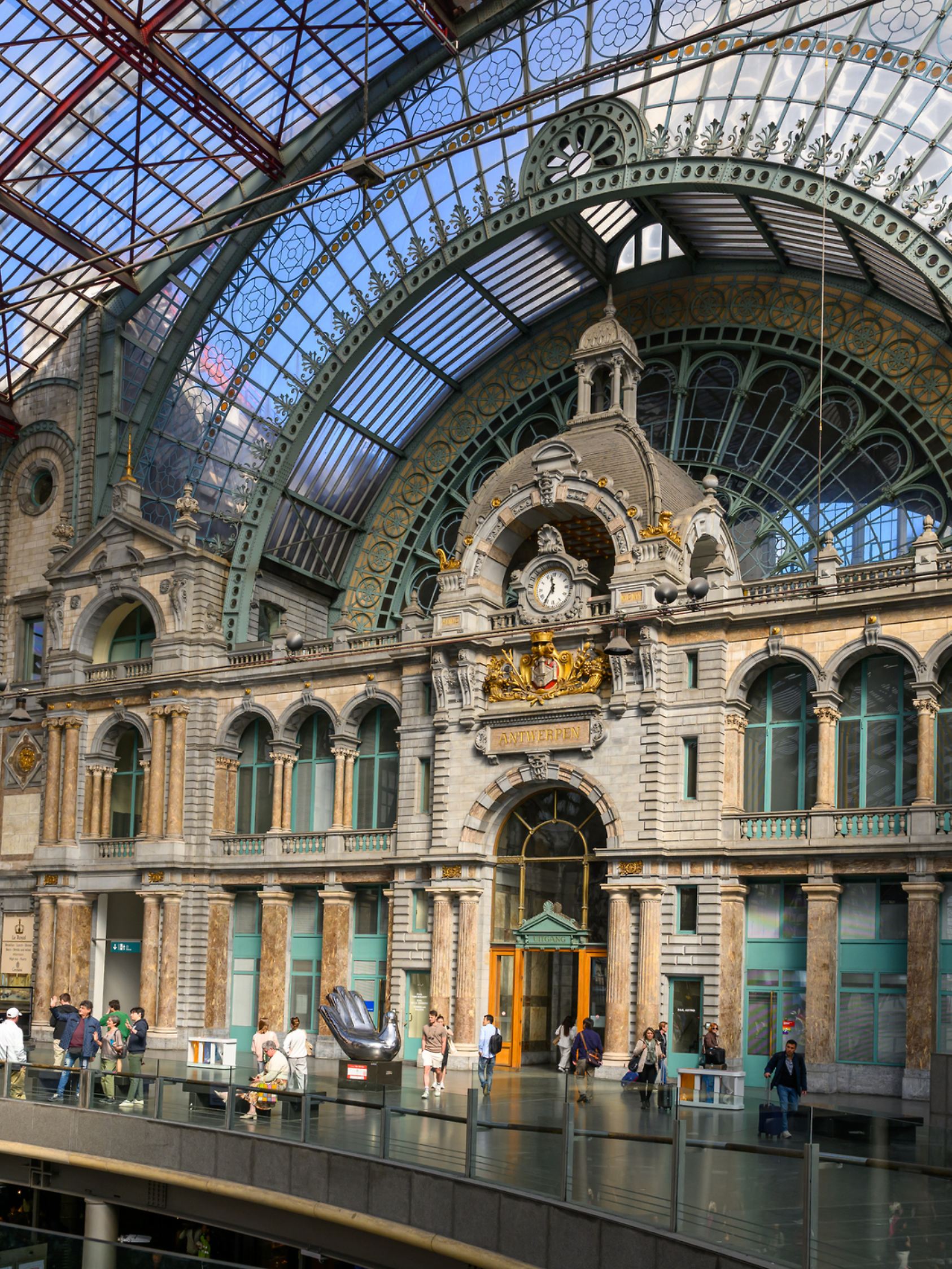 Antwerp, Belgium - Apr 12, 2025: Sunlight Illuminated train shed of Antwerpen-Centraal railway station, which is widely regarded as one of the most beautiful train stations in the world.