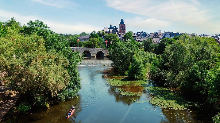 view on historic Wetzlar at Lahn river with weir in the foreground and church in the background