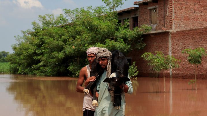Monsoon rains and rising water levels in Qadirabad village near the Chenab River