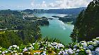 
Picturesque view of Sete Cidades in Azores, Sao Miguel. Volcanic craters and stunning lakes at sunny day. Ponta Delgada, Portugal. Natural wonders, landmarks and tourist attractions concept