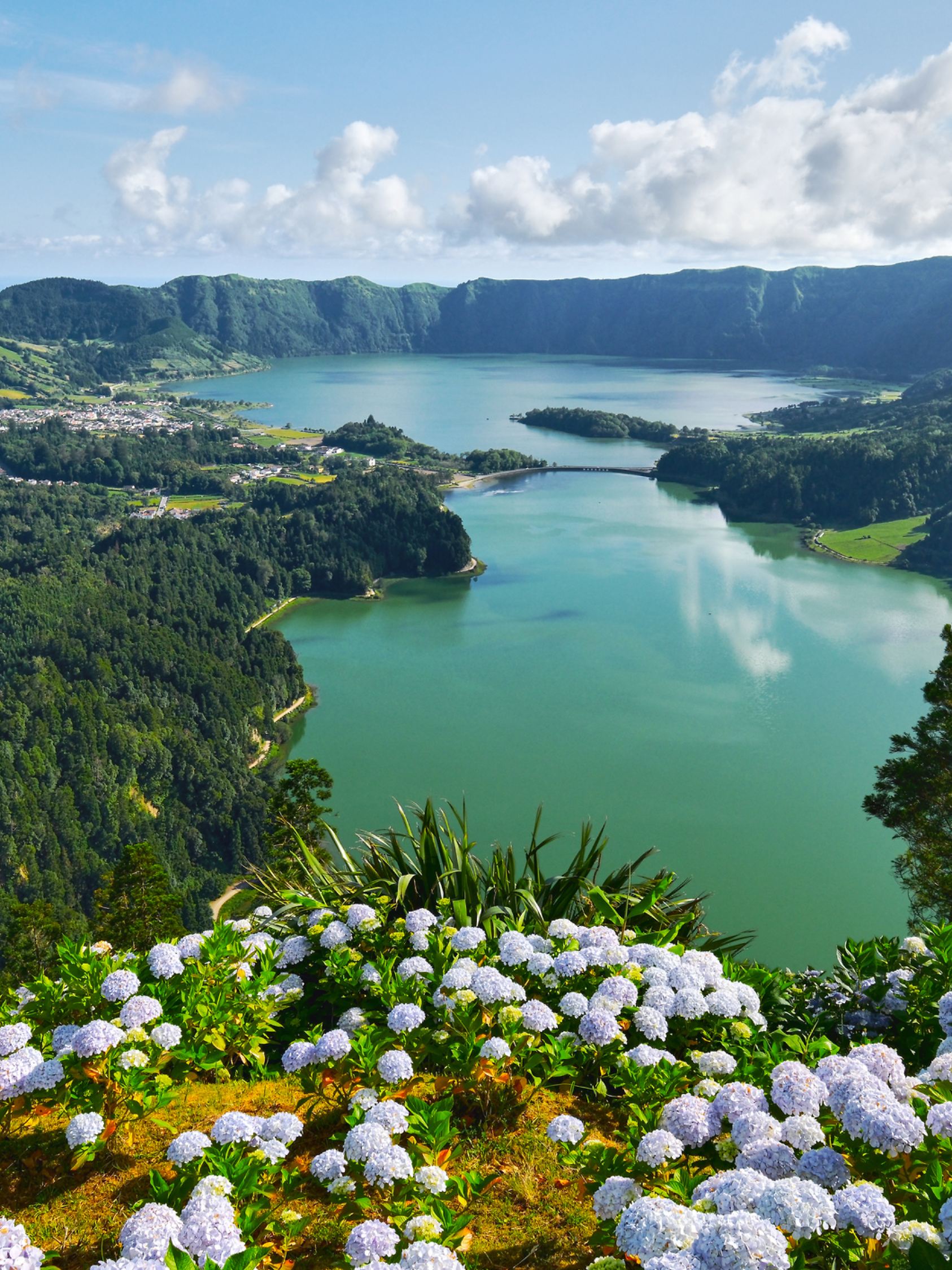 
Picturesque view of Sete Cidades in Azores, Sao Miguel. Volcanic craters and stunning lakes at sunny day. Ponta Delgada, Portugal. Natural wonders, landmarks and tourist attractions concept