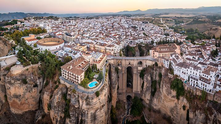 Aerial panoramic view of Ronda early in the morning. Puente nuevo bridge and cliff in the front. Ronda is a town in the Spanish province of Málaga.